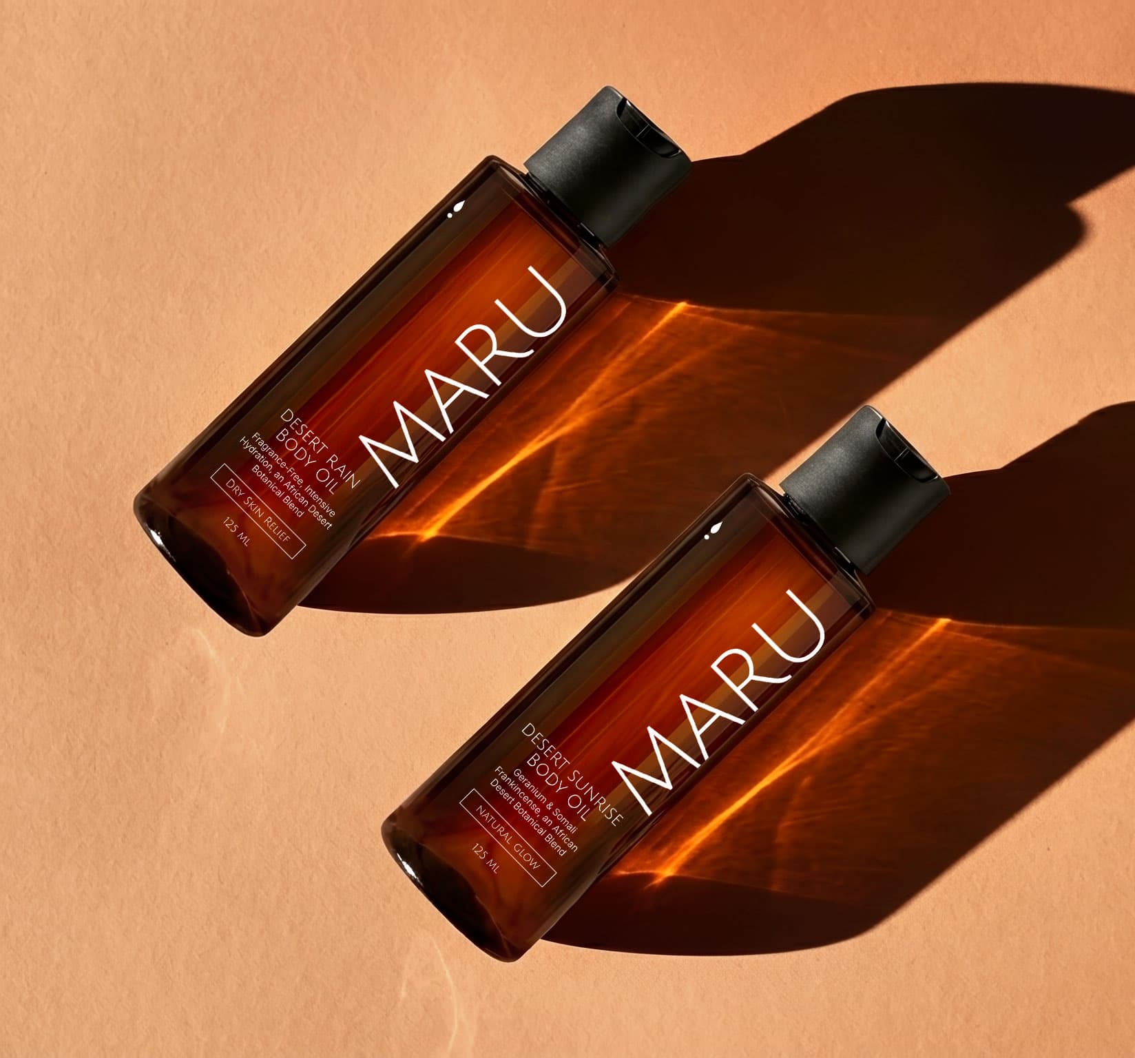 Maru body oil bottle on a soft background, designed for melanin-rich skin